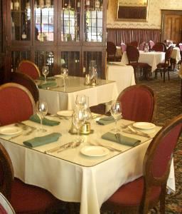 1859 Historic National Hotel, Jamestown — Our elegant Victorian dining area is perfect for receptions, wedding dinners and weddings. In warm weather couples often choose to have the ceremony on our vine covered patio and move inside for the reception dining and socializing. Along with our above average dining fare, we offer a full service bar. Nine romantic historic rooms in on second floor.