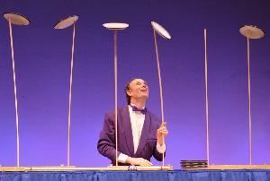 NW Corporate Comedy, Los Angeles — Henrik Bothe's physical comedy show spans from classic plate spinning routine to Hi-Tech glow in the dark optical illusion "Neonman"