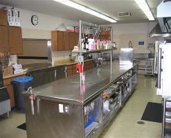Commercial Kitchen, Castro Valley Masonic Center, Castro Valley — The fully equipped commercial Kitchen measures 18 ft X 34 ft, and is well lit with easy access to the Banquet Room.  A brick Barbeque is located immediately outside the Kitchen.  

A six burner gas stove with large griddle, two gas ovens, convection oven, refrigerators, freezers, food preparation counters, ice machine, dishwasher, cleaning and drying areas are provided.  Kitchen pots, pans, cooking items, tableware, dishes and glasses are provided.