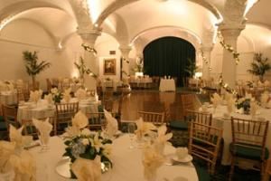 Romanesque Room, Castle Catering - The Romanesque Room, Pasadena — The Romanesque Room, located at 50 East Green Street in Old Pasadena, is in the historical Green Hotel, which is on the National Registry of important places.

A separate double-oak doorway with beautiful stained glass window leads to the exquisite ballroom named for its beautiful vaulted decorated ceiling. 

This lovely facility welcomes up to 300 guests for dinner and dancing in the graceful curved ballroom with a large airy attached bar and garden. The pillared interior lends itself to smaller groups as well.