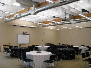 The Event Room, OneREALTOR®Center, Tyler — The Event Room can seat up to  130 with 60" rounds or up to 160 theatre style.  It offers a SMART board, 2 DLP Projectors with drop down screens, free wifi, adjustable lighting, incredible sound system and a full catering kitchen.