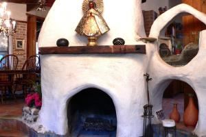 Casa De Luna Room, El Rocio Retreat, Mission — Free form fireplace in sunken living room off of the dining room and kitchen