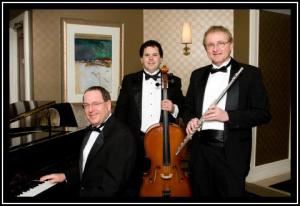 Mike Davis Trio, Traverse City — The Mike Davis Trio is one of the most popular music trios in Northern Michigan. The music trio is comprised of three outstanding professional musicians that perform as both a classical trio and a jazz trio. The classical trio includes flute/vocal, cello/bass, and piano. This combination of instruments, performing a wide variety of wedding classics, is ideal for wedding ceremonies. We can also provide vocals in several different styles from classical to pop ballads.

The same three talented musicians also perform as jazz trio on sax, bass and piano. The trio plays a wide variety of jazz styles including standards, swing, Latin, and contemporary. Our jazz trio is the perfect musical choice for cocktail hours, dinner receptions, and private parties. Mike is also a talented vocalist who can sing all the great jazz standards performed by Frank Sinatra, Tony Bennett, and others.