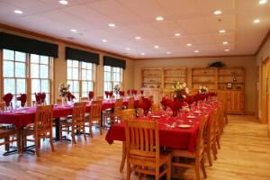 Dining room, Burnt Pine Weddings and Special Events, Newborn — The main lodge dining room seats 50, and up to 70 utilizing the deck. Choices of menus from buffets to seated/plated five course meals are available.