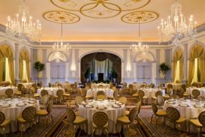 Ballroom, The Fairfax at Embassy Row, Washington — Up to 250 guests are comfortably accommodated in the The Ballroom (2,600 square feet) at the Fairfax at Embassy Row, a grand location for your Washington, D.C. wedding. Our hotel strives to reach beyond all expectations. Guests of The Ballroom are invited to watch the wedding ceremony from the Balcony Room, which overlooks the larger space and is also a lovely perch for a cocktail reception. Once the main reception begins, a separate entrance into a gleaming marble foyer leads to spacious and elegantly appointed space that includes a large dance floor and customized table settings.