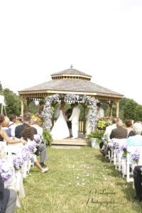 Grand Allee Gazebo, Toledo Botanical Garden, Toledo — Grand Allée:
Our largest ceremony site offers open space and is flanked by rows of beautiful Silver Linden trees. A charming gazebo adds to the ambiance. Fits 500 guests. $500