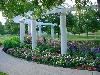 Rose Garden, Sioux City — The trellis and roses are a colorful backdrop for any occasion.