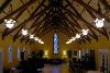 The Chapel, Grand Holiday Ballroom, Olympia — This magnificent room has the charm and architectural details that are reminiscent of European countryside chapels with open beamed ceiling supports that support classic steeply sided open ceilings.

Three of four walls display subtle yet richly colored antique stained glass windows. 

Ceremony occupancy capacities vary from 50 to 200, depending upon seating and ceremony floor layouts. We have many options with which to arrange and divide this space to make it spacious and opulent, or warm and cozy. 

Two side rooms provide entertaining needs and or space for musicians. The side alcove offers a quaint and classic location for available light portraits. Just outside this alcove is your secret garden, also providing a charming tiny portrait opportunity location.
