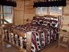 Luxury Blue Ridge Cabin Accommodations, Blue Ridge — 2nd Bedroom on Main Level features a Queen Log Bed and furniture.