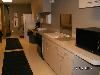 1/2 Community Room, Bogan Park, Buford — Bogan Park Kitchen has a refrigerator, microwave, ice machine and a warming oven.