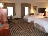 Hampton Inn & Suites Dayton - Vandalia, Dayton — This spacious non-smoking room features two double beds, 25" color television, easy to operate alarm clock/radio and large work surface. The high-speed internet access will help you stay connected while on the road. If you prefer not to work at the work space, you can use the convenient lapdesk instead. You'll also enjoy the convenience of having a coffee maker and iron/ironing board in your room. In the bathroom you'll enjoy fluffy towels, a WaterPik® showerhead and curved shower rod that allows more light and space in the shower.