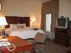 Hampton Inn & Suites Dayton - Vandalia, Dayton — This spacious non-smoking room features a king-sized bed, comfortable easy chair with ottoman, 25" color television, easy to operate alarm clock/radio and large work surface. The high-speed internet access will help you stay connected while on the road. If you prefer not to work at the desk, you can use the convenient lapdesk instead. You'll also enjoy the convenience of having a coffee maker and iron/ironing board in your room. In the bathroom you'll enjoy fluffy towels, a WaterPik® showerhead and curved shower rod that allows more light and space in the shower.