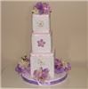 Enchanted Decorating Designs, Tampa — This unique designed centerpiece was made using top quality silk hydrandea flowers. It consists of 3 covered foam blocks which sits on a 12" disc base which is decorated with ribbon and silk flowers. It stands 16"H x 12"W.