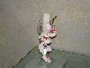 Enchanted Decorating Designs, Tampa — This would surely make your table setting stand out. This candle holder stands at 14" tall including the candle with a base measuring 4" wide and a top opening of 3 1/2" wide. The glass at the top is crackled so it adds to the design of the holder. It is complimented with orchids which are wrapped around the frame from top to bottom.
