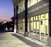 BancorpSouth Conference Center, Tupelo — Side view of the BancorpSouth Conference Center at dusk. The old Tupelo Courthouse is in the background.