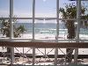 Beach Walk Crystal Beach, Destin — Beach Walk Crystal Beach is like the one and only heir to a rich tycoon. Its back wall (two stories, all glass) opens to a view that isn’t of a beach-off-in-the-distance but an immediate, present beach. It’s an arm’s length from the nearest indoor table and practically merging with the deck outside. Coconut white and wisped with seagrass, it barely holds back the green-blue Gulf of Mexico.