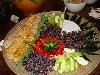 The Cheesecake Lady Catering Company, Tulsa — The Cheese Board takes on a modern twist with Cheddar Pecan Wreath with Plum Sauce in the middle surrounded by fresh fruit and crackers and served on a 30" bamboo tray.