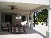The Wilson Private Garden, The Wilson Private Garden, Kissimmee — Shaded seating area, below balcony on raise deck.