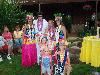 All For Fun  Entertainment Chicago, Illinois, Chicago — Elvis Aloha Hawaii Hula Dancers 
Chicago Luau Party Entertainment 
847-825-5558
Click Here Discount Luau Party Supplies
The hula is the folkdance of the Hawaiian people which interprets the words and meanings of the rhythmic dance chants called the mele hula. In the commonest form of the hula, the dancer's body remains relatively stable, feet mark the time, and arms and hands describe or interpret the meanings of the words in the mele hula. In the more exuberant forms the dancers move about entertainingly using the body as well as the feet and hands.

Elvis Presley made television and entertainment history with Aloha From Hawaii Concert as this was the first-ever live concert broadcast over satellite, reaching over one billion people worldwide.
E.Elvis And The Aloha Hawaii Hula Dancers