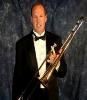 Romance, Fort Lauderdale — Kevin Arney, Trombone, Vocals - Attended High School in Florida where he became involved in music. Proficient on Trombone,  in his Senior year was one of the top trombone players in the State.

Kevin then attended the University of Miami where he was the lead trombone player in the  University of Miami Jazz Ensembles.  After a couple of years he left the University to hit the road with the Joe Trippi band where he played the trombone and sang. While performing professionally Kevin played on the cruise ship the S.S. Norway where the band accompanied such stars as Jack Jones and Vic Damone.

Kevin is proficient in several instruments including piano and saxophone. He has performed all over the United States and Europe with various musical organizations.  His vocal style has always been a plus when performing.  

Kevin and his father have played together for about 30 years and have always been huge fans of the Big Band Era and the Frank Sinatra Style Music.