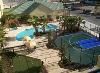 Homewood Suites by Hilton - Ocala at Heath Brook, Ocala — Spacious outdoor courtyard with heated swimming pool, whirlpool, sports court and putting green.