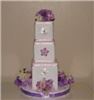 Enchanted Decorating Designs, Tampa — This Centerpiece will surely be an attention stopper. It consists of 3 covered foam blocks which are decorated with flowers and it sits on a 12" foam disc. It is decorated on all sides of the base and the top with pink and lavender hydrangeas and lavender ribbon. Please check our website at www.enchanteddecoratingdesigns.com for our full selection.