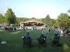 Packard Amphitheater, Dubuque Arboretum and Botanical Garden @ Marshall Park, Dubuque — Spectators watching a musical performance with the Amphitheater in the background.