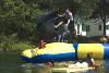 Waterfront, Camp Scully, Wynantskill — Our beach borders Snyder's Lake. A giant water trampoline and launcher is very popular. Sailing, kayaking and canoeing are available from our dock. Beach parties and BBQ's can be held.