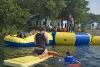 Waterfront, Camp Scully, Wynantskill — Our beach borders Snyder's Lake. A giant water trampoline and launcher is very popular. Sailing, kayaking and canoeing are available from our dock. Beach parties and BBQ's can be held.