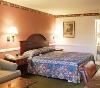 Dynasty Suites Hotel, Riverside — The Deluxe King 
Our Deluxe King is perfect for the business traveler, as well as couples on the go. This room consists of a California King Size bed, a sofa/sleeper couch, and coffee table.