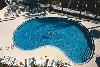 Hampton Inn Cocoa Beach, Cocoa Beach — The relaxing pool area is surrounded by Florida palm trees and offers guests a place to relax or play
