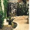 Bob Doster's Backstreet Studio & Gallery, Lancaster — Outdoor garden area features sculpture, fishponds, waterfalls.  Private area surrounded by ivy-covered walls.