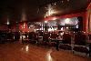 Laughs Comedy Spot, Kirkland — Laughs Comedy Spot holds up to 220 people with a Stage, sound system, 140 chairs, 12 barstools, and 70 tables.  With warm red and brown tones and soft lighting and drapes this a great location for a meeting, receptions or party with or without comedy! Located directly of of I-405 with plenty of free parking