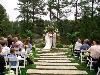 A Wedding Minister, Raleigh — Arena and Chuck's wedding was at The Umstead Hotel and Spa in Cary. It is an elegant setting with the lake and fountain in the background. The flowers were beautiful and rose petals were heaped around the base of the pedestals and flowing out onto the grass. Arena's grandfather walked her down the aisle but did not have his hearing aid turned on and could not hear me ask the question of who was supporting and blessing Arena as she came to join in marriage with Chuck! But, we assumed the answer and proceeded with their wonderful ceremony.