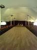 Camelot Special Events & Tents, Inc., Wakefield — The Fashion Show runway in this photo was installed under a 60x140 foot tent with electric heat, lighting, and sound.  All power came from two super quiet production quality generators.

Seating was installed on both sides of the runway, and a back stage area was created out of Pipe & Drape with double stair access through the center.  The stage was eight feet by 108 feet long and was topped with flooring to give it a great finish.