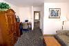 Cortona Inn & Suites Anaheim Resort, Anaheim — Siena suites feature two rooms. One room includes 2 Queen Beds while a separate living room includes a queen sofa-sleeper and coffee table. This spacious suite is perfect to entertain guests. Suites offer a microwave, refrigerator, fresh brew coffee-maker, iron & ironing board, work desk with light with chair, high speed Internet access, 2-27” televisions with premium cable and pay-per-view movies, in-room safe and individual climate controls and more. Sleeps up to 6 persons with existing bedding.