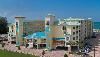 Sunset Vistas Beachfront Suites, Saint Petersburg — "The Perfect Combination of Extra Large Suites and Resort Amenities" - SUNSET VISTAS BEACHFRONT SUITES, located directly on the powder, sugar white sands of Treasure Island offers full-service resort amenities such as 24-hour front desk, restaurant/café with convenience store, beach bar, free reserved parking, business & fitness center, large free-formed heated pool, 2 whirlpools and children’s wading/fountain pool. Each 810 sq. ft. suite includes two bedrooms, two bathrooms, separate dining/living room with queen sleeper/sofa, fully equipped kitchen with full-size appliances and private balcony with breathtaking views of the Gulf. Your suite features “Tommy Bahama” style furnishings, granite counter tops, in-suite washer/dryer, two televisions with VCR/DVD. Walking distance to John’s Pass Village & Boardwalk, shopping, restaurants, casino cruise, water sports, a short drive from Tampa International Airport and Busch Gardens. We are the ideal location for your intimate wedding or family reunion, anniversary or birthday party!