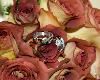 Photocraft By Tom Warriner, Destin — The wedding rings and bridal bouquet.