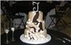 Art Eats Bakery, Greenville — Three tier fondant wedding cake with sugar butterflies and chocolate swirls.
We specialize in creative artistic designed cakes that are as delicious as they look for any special day. A wedding, birthday, anniversary, new baby, ect. should be celebrated in style. Cakes can be sculpted into any shape you desire. Serving Greenville, Simpsonville, Mauldin, Greer and surrounding Upstate South Carolina areas.  email at sales@arteats.com 
  All cakes and icings are scratch made with the finest fresh ingredients available. Real butter, cream cheese, eggs and fine chocolates make our confections melt in your mouth delicious.