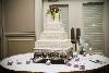 All Occasion Celebrations, Simpsonville — Cake table with votive accents.