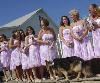 Roland Photo and Video Services, East Weymouth — This was a wedding that we covered in White Horse Beach in Plymouth. Notice the # of bridesmaids. They putted a big tent at the beach and used a caterer for the food. The dog which is a part of the wedding had some flowers on his neck.