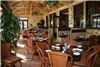 Tommy Bahama's Bar & Grill, Miramar Beach — The Garden Room's window are actually doors that open up to the tropical patio.