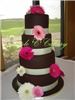 Triple C Cakery, Barrie — Gerbera daisies add colour to this tall and stately cake.  Once again each tier is a differnt flavour ranging from banana chocolate to white sour cream cake filled with lemon and raspberry fillings.  So good!
