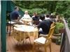 Meeting Oasis, Great Falls — Participants meet on deck surrounded by natural woods.