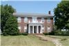 Agnus Dei Farm, LLC, Lexington — Entrance of Historic Home.  A brick walkway and portico with lawn in front of house.