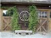 Rustic Style Barn Wedding Venue, Victoria Garden Estate, North Saanich — Wagon wheel on the front of the Barn