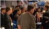 Turner Magic Entertainment, Atlanta — Trade show magician Joe M. Turner gathering a crowd at his client's booth at the Consumer Electronics Show in Las Vegas.
