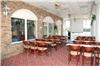 Meeting/Banquet/Conference Room, Best Western Greenville Airport Inn, Greenville — This is the Porch at Pelham. It will seat app 50 classroom style. Room is long and narrow with glass front.