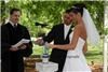 WEDDING OFFICIANTS ATLANTA, Atlanta — REVEREND THOMAS JOHNSON PERFORMING UNITY CANDLE CEREMONY FOR UNIVERSITY OF GEORGIA ALL-AMERICAN BOB SAMSON AND WIFE IN OUTDOOR CEREMONY AT THE UGA CHAPEL.