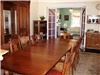 Entertainment area, Ashley Rose Victorian Inn, Cape May — This is the dining area, seats up to 18.  You can see the living room in the background.  The table can be reduce to as small as a 4x4 for banquet serving.  The livingroom is larger and opens to the wrap around porch